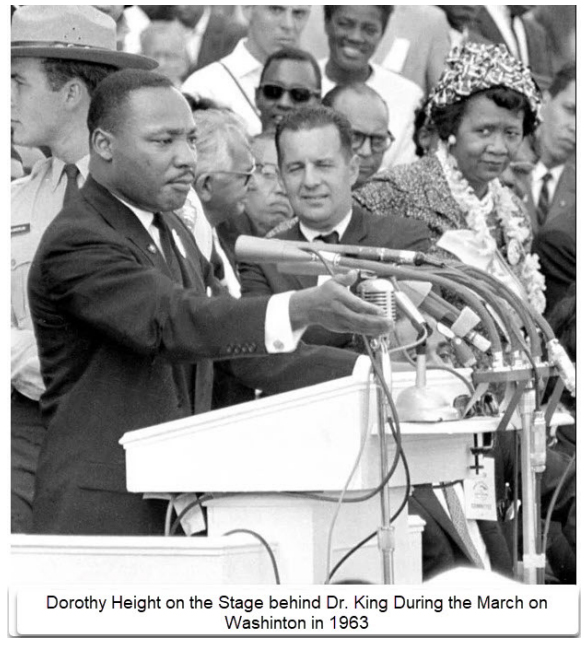 Dorothy Height on the stage behind Dr. King during the March on Washington in 1963