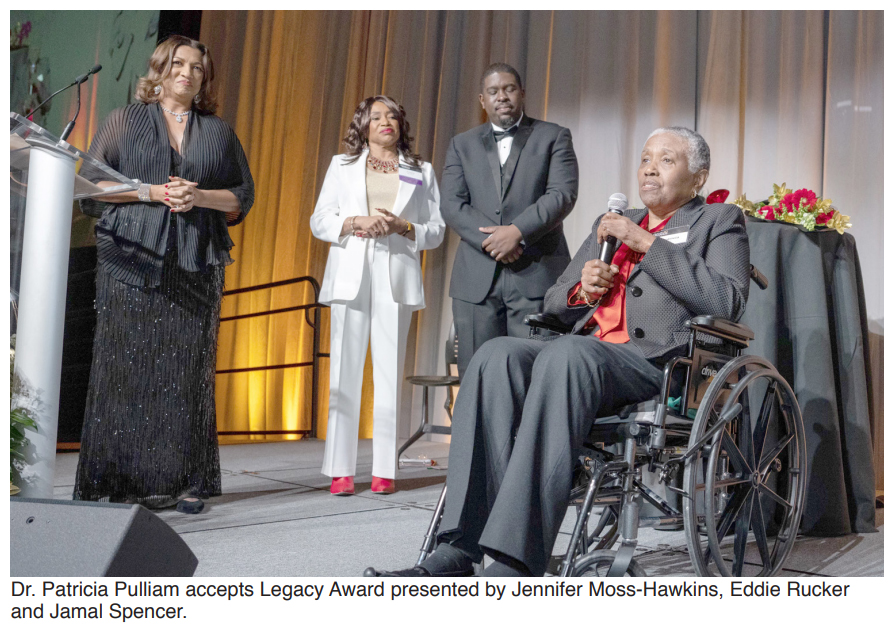 Dr. Patricia Pulliam accepts Legacy Award presented by Jennifer Moss-Hawkins, Eddie Rucker and Jamal Spencer.
